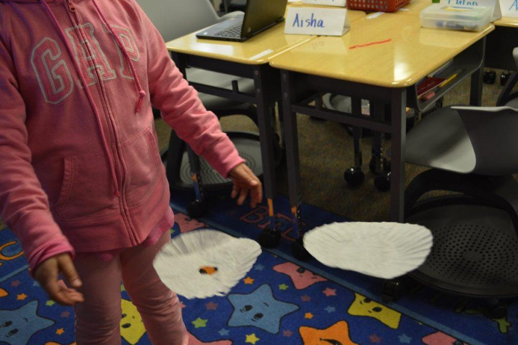 a student drops a parachute