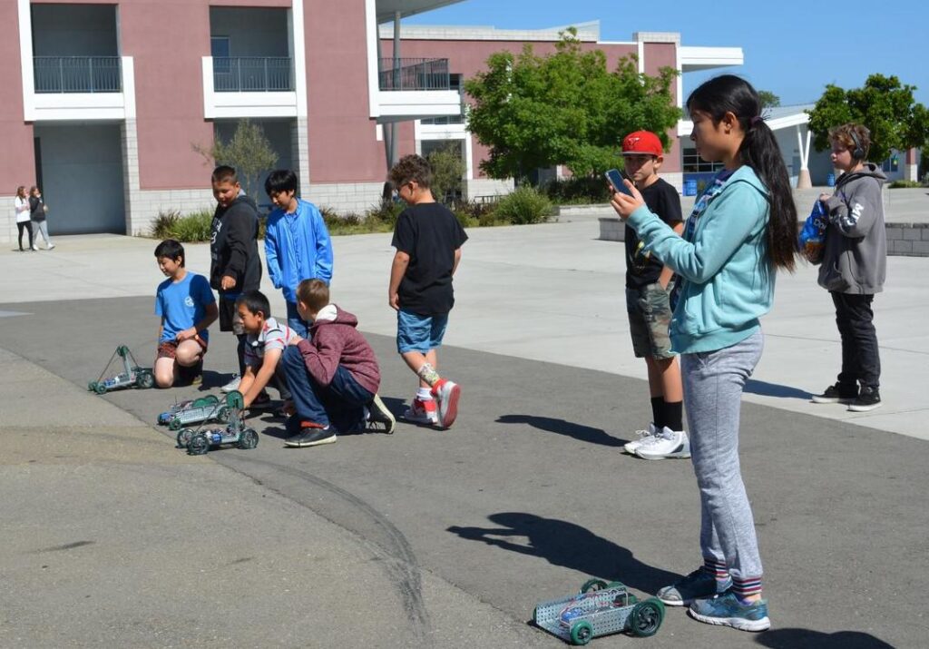 students with robotics cars