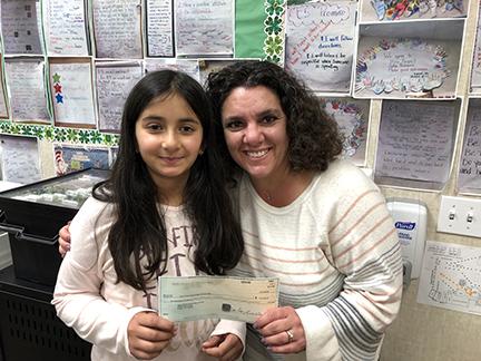 Principal Dr. Lorianne Ventura and a Green Elementary School student