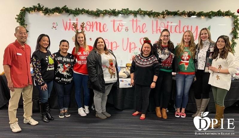 Extended Day Care Staff helping to wrap presents EDCC
