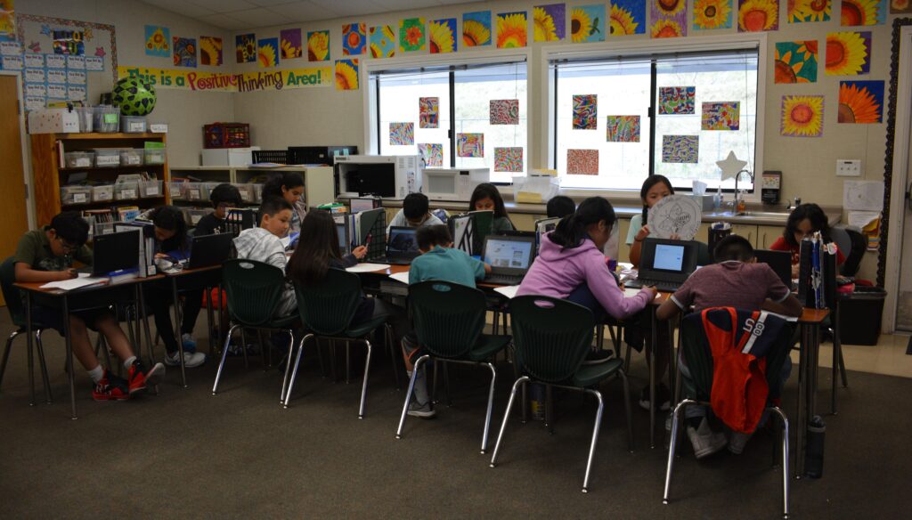 Students using Chrome Books kids using chromebooks