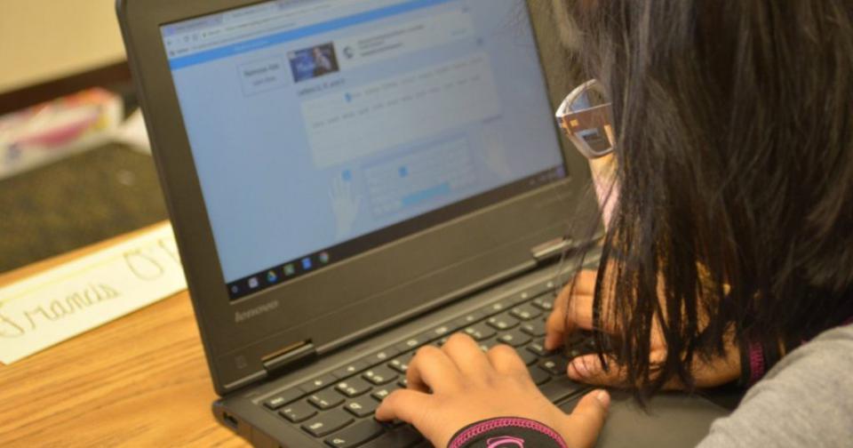 student working on laptop